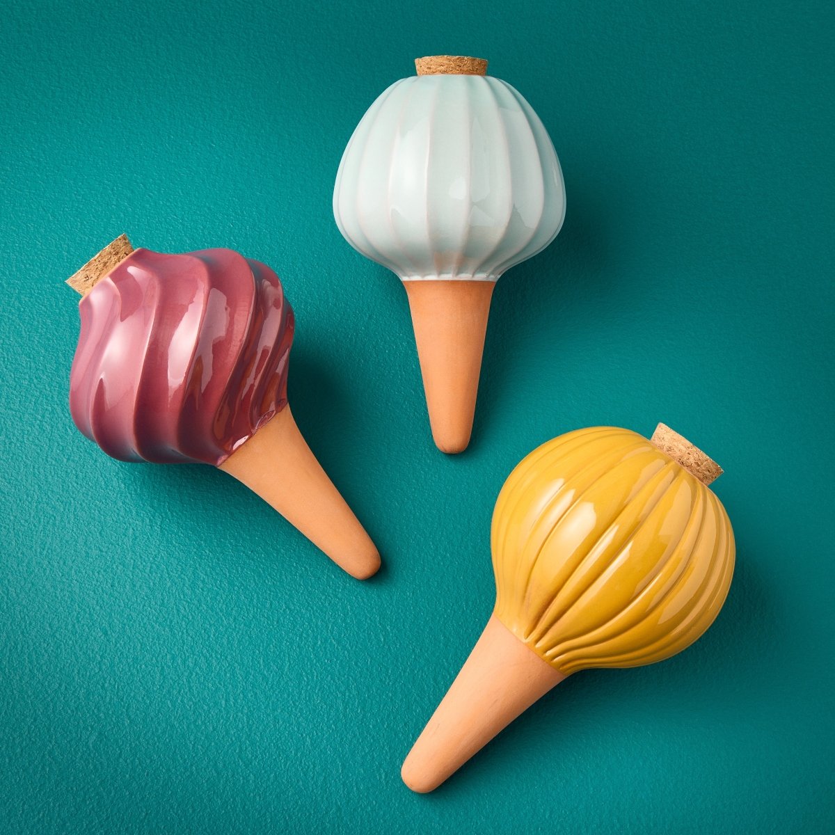 Glazed terracotta watering bulbs for balanced, worry-free plant watering.