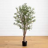 Potted artificial olive tree on a wooden floor with a white wall background