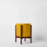 Yellow planter with wooden frame on a white background