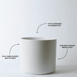 White pot with text describing its features on a white background