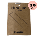 Mossify floral pins packaging with a brown cardboard backing and '10 pins' label.