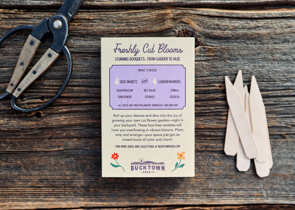 Gardening tools and a card on a wooden surface with 'Bucktown' branding.