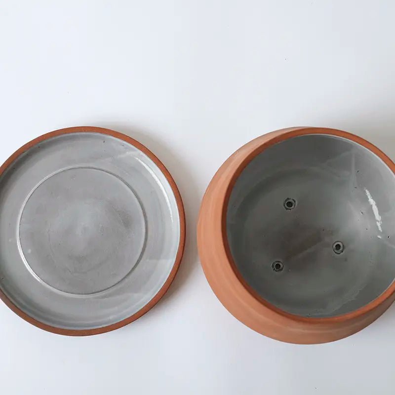 Close-up of Rancho Planter showing raw clay exterior and smooth glazed interior