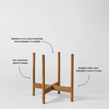 Wooden plant stand with text highlighting features on a white background