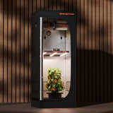 Spider Farmer indoor gardening system with plants on a wooden background