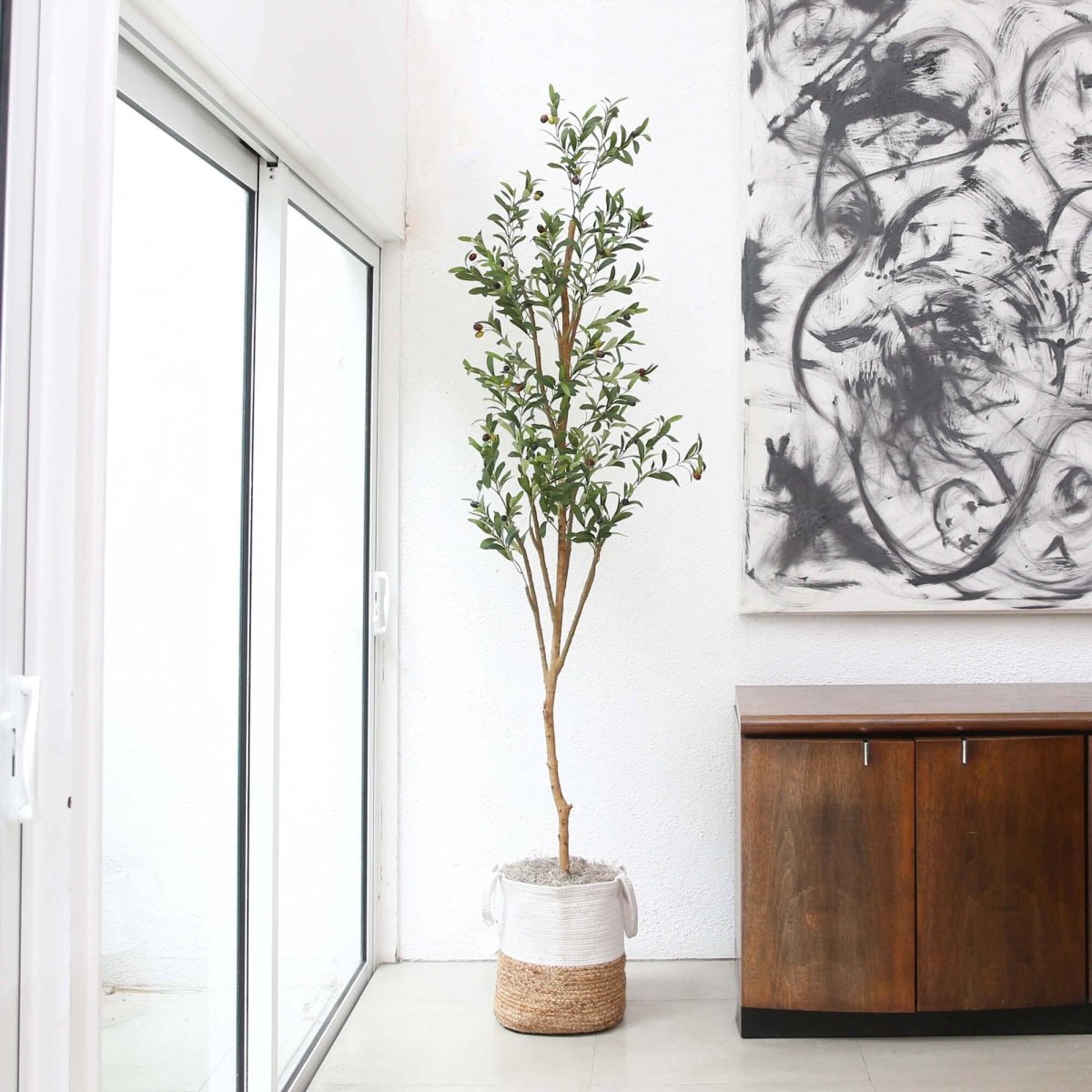 7’ Artificial Olive Tree in Sunny Living Room with floor-to-ceiling windows
